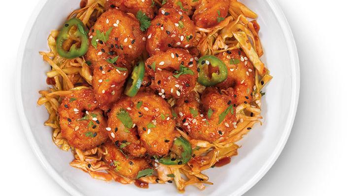 Korean Fried Shrimp · Hand-breaded, fried shrimp, tossed in Gochujang sauce atop a bed of Korean BBQ slaw with jalapenos, sesame seeds and cilantro.