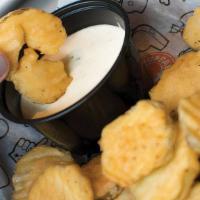 Fried Pickle Chips · Lightly breaded and fried to perfection, served with ranch dressing.