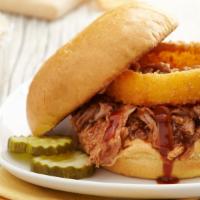 Double Bbq Pork · Tender pulled pork, sweet BBQ sauce, and 'bama white BBQ sauce, topped with one of our signa...