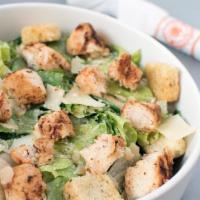 Blackened Chicken Caesar · Blackened chicken, served over romaine leaves, topped with Parmesan and croutons, tossed in ...