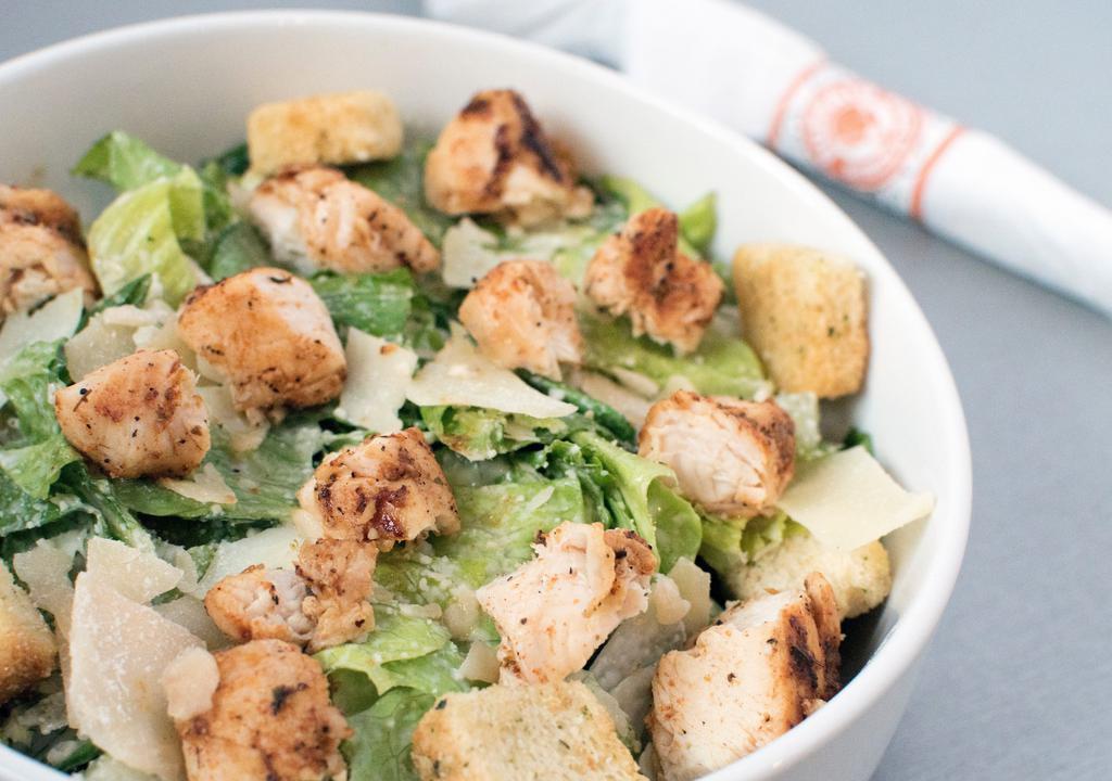 Blackened Chicken Caesar · Blackened chicken, served over romaine leaves, topped with Parmesan and croutons, tossed in Caesar dressing.