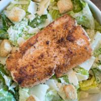 Blackened Salmon Caesar · Blackened salmon, served over romaine leaves, topped with Parmesan and croutons, tossed in C...