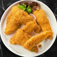 Band Of Chicken Tenders · Chicken tenders breaded and fried until golden brown. Served with your choice of dipping sau...