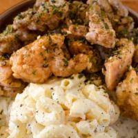 Garlic Furikake Chicken · Crispy fried chicken lathered in sweet garlic soy, includes rice and one choice of side.