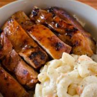 Hawaiian Teriyaki Chicken · Marinated in pineapple teriyaki sauce and flamed grilled, includes rice and one choice of si...