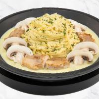 Cream Teppan Pasta · Mushrooms and cream sauce over pasta.