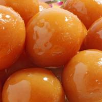 Gulab Jamun · Indian milk cheese balls fried & soaked in honey syrup.