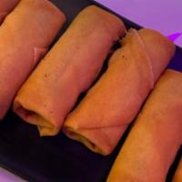Vegetable Egg Rolls · Vegetarian egg rolls served with sweet and sour sauce.