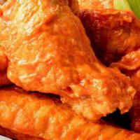 10 Wings · 10 Jumbo Bone-In Wings tossed in your choice of up to 2 sauces.  Served with celery and ranc...
