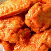 15 Wings · 15 Jumbo Bone-In Wings tossed in your choice of up to 2 sauces.  Served with celery and ranc...