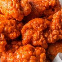 10 Boneless · 10 Boneless Wings tossed in your choice of up to 2 sauces.  Served with celery and ranch or ...