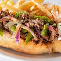 Steak Philly · Thinly sliced grilled steak piled high with sauteed onions and peppers then topped with melt...