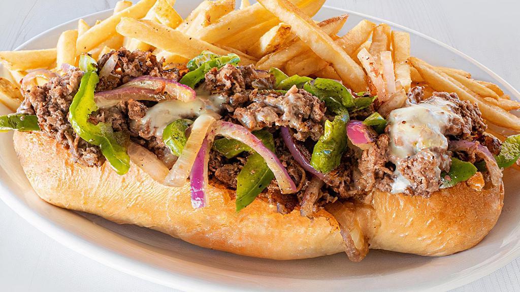 Steak Philly · Thinly sliced steak stacked high on a toasted hoagie roll with peppers and onions and melted American cheese. Served with a side item. (1270-1540 cal.)