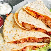 Shrimp Blt Quesadilla · A fusion of bold flavors, this grilled flour tortilla is chock full of fried shrimp, crumble...