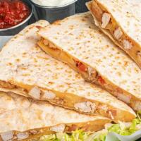 Monterey Chicken Quesadilla · Monterey jack and cheddar cheese melt together in a flour tortilla stuffed with tender grill...
