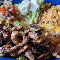 Al Pastor Fajitas · This is a secret family recipe. All we can tell you is it's pork marinated in garlic, pepper...