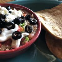 Five Layer Dip · Four different types of cheeses, two sauces, two 
salsas, olives, onions, sour cream and ref...