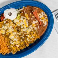 Chimi Especial - Dos · Two chimichangas served with rice and beans
