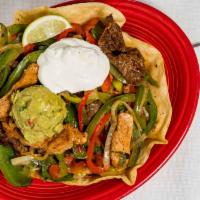 Fajita Salad · We take your favorite fajitas and serve them on a romaine lettuce mix, tossed with our own p...