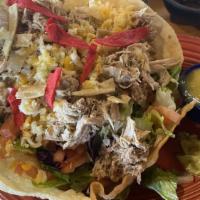 Taco Salad · A meal in itself. All the great ingredients that make up a taco, served cold in a flour chal...