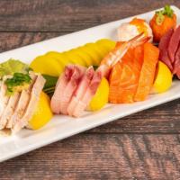 Sashimi Deluxe · 15 pieces. Chef choice of fresh-cut sashimi. Served with miso soup.