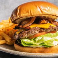 Bodega Burger · USDA Prime ground beef hand pressed, topped with bacon, American cheese, lettuce, tomato, an...