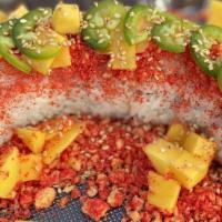 Mango Roll · Inside: Spicy crab surimi, cucumber, avocado Top: Fresh salmon, mango, sliced jalapeño, spic...