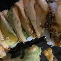 Tiger Roll · Inside: Shrimp tempura, spicy crab surimi, cucumber & cream cheeseTop: shrimp, avocado, spic...
