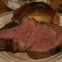 Prime Rib Sandwich · Freshly carved off the bone, on baguette with grilled onions, au-jus, whipped horseradish, s...