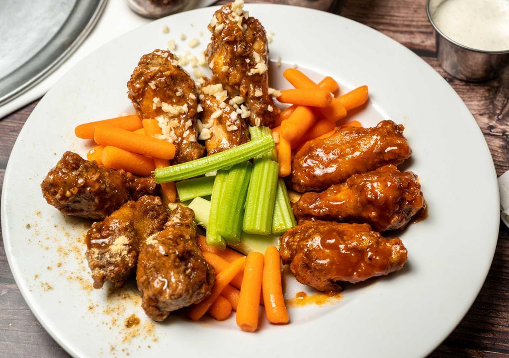 Wings · Our wings are unique!! 
House made, custom seasonings, fused with our made from scratch sauces. All wings are served crispy and bathed in their own custom sauces. 

Wing partners: celery, carrots, ranch or blue cheese.