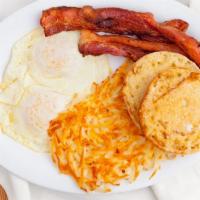 All American · 2 eggs, bacon or sausage, hash-browns, and toast white, wheat or English muffin.