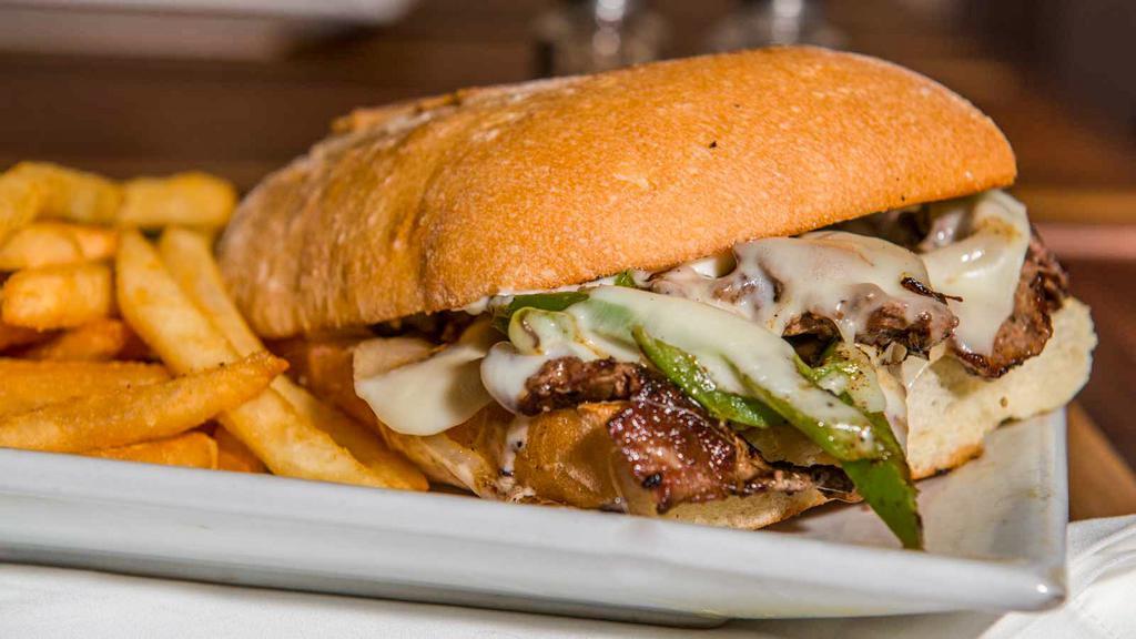 Philly Cheese Steak · Steak topped with grilled onions, bell peppers and Jack cheese on ciabatta bread.