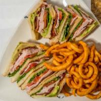 California Club · Filled with turkey, bacon, avocado, tomatoes, lettuce & Jack cheese.