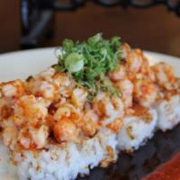 Baked Langostino Roll · Spicy. In: Crab, avocado, cucumber, out: langostino, soy paper, eel sauce, green onion.