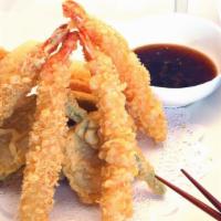 Tempura Dinner Plate · 4 shrimp, 4 mixed vegetable tempura, rice, salad, and miso soup.