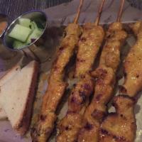 Satay · Contains peanut. Marinated skewers served with peanut sauce and cucumber salad.