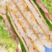 Vegan Chipotle Chickun Sandwich · Soy-chickun patty, pepper jack cheeze, avocado, lettuce, tomato, chipotle mayo on a warm cia...