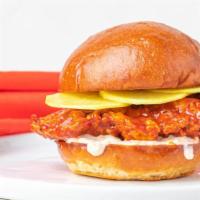 Korean Fried Chicken Sandwich · Super Crispy fried chicken tossed in our favorite Korean BBQ sauce with pickled daikon and k...
