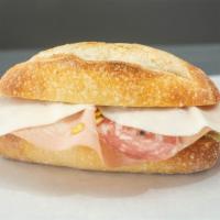 The Italian Sandwich · Genoa salami, soppressata, mortadella, Italian ham, provolone, tomatoes, iceberg.