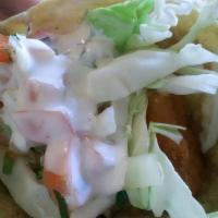Fish Taco · Crispy fry fish, cabbage, pico de gallo and homemade  creamy white sauce.