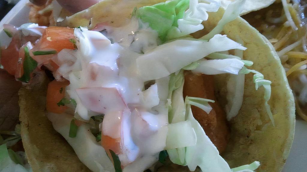 Fish Taco · Crispy fry fish, cabbage, pico de gallo and homemade  creamy white sauce.