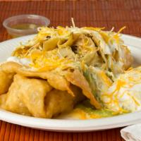 Chimichanga · Choice of shredded beef or chicken, cheese, topped with cheese, sour cream and guacamole.