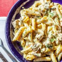 Scarface · Sautéed chicken and mushrooms in a white sauce over penne pasta.