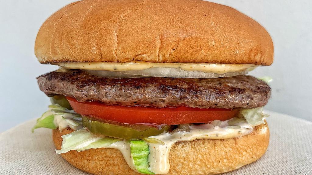 Hamburger · 100% beef patty, lettuce, tomatoes, onions, pickles, thousand island sauce, on toasted bun.