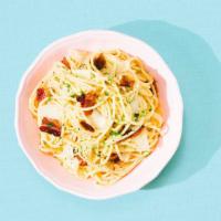 Pasta Carbonara · Spaghetti in a classic Carbonara sauce of egg yolks and cheese mixed with crispy bacon and t...