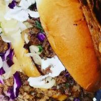 Torta · Your choice of asada, pastor, chicken, or shredded beef. Beans, cheese, cabbage, onion, cila...