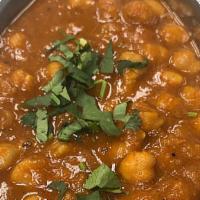 Chana Masala · Vegan. Chickpea curry made from white chickpeas in sauce seasoned with ginger, onions, garli...