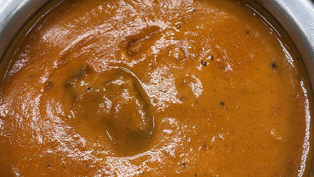 Lamb Tikka Masala · Lamb cooked with herbs and Indian spices in a creamy tomato sauce.