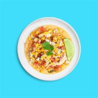 Grilled Chicken Elote Taco · Grilled chicken with corn, pico de gallo, cotija, and cilantro loaded into a corn tortilla.