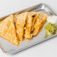 Quesadilla · Flour tortilla filled with jack cheese and filling. Served with guacamole, sour cream, and t...
